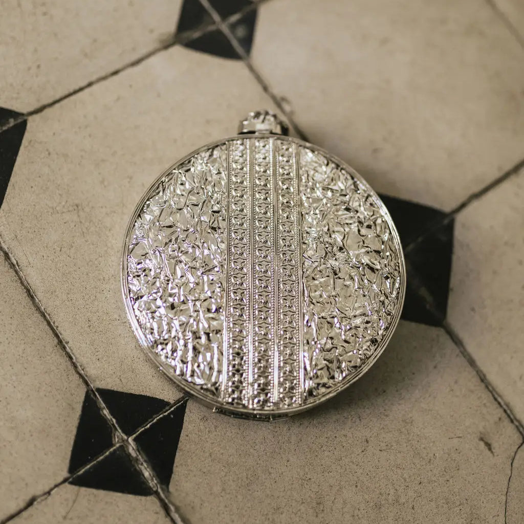 Luminia Silver Mother-of-Pearl Shine Deluxe Circular Clutch